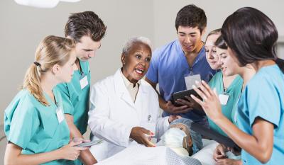 Medical students training with the doctor.